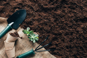 top soil with garden tools