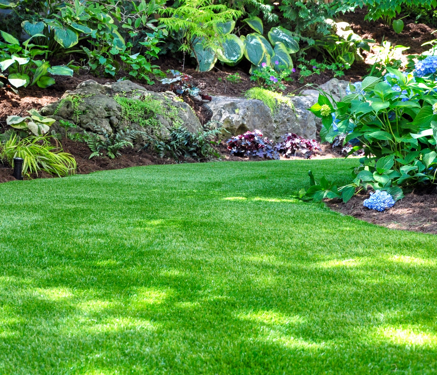 well manicured garden area with shredded topsoil