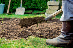 shovel with scoop of dirt