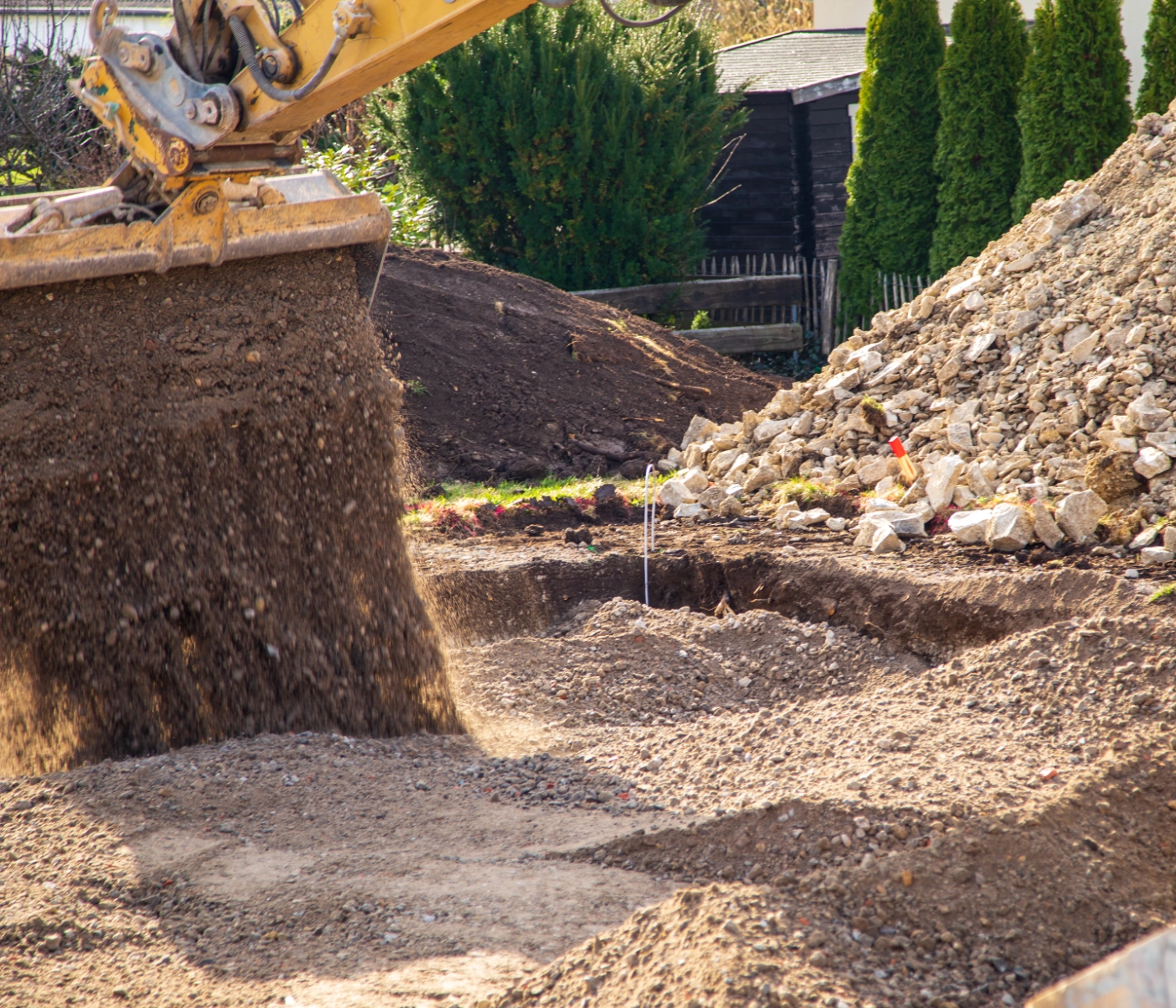 digger dumping fill dirt